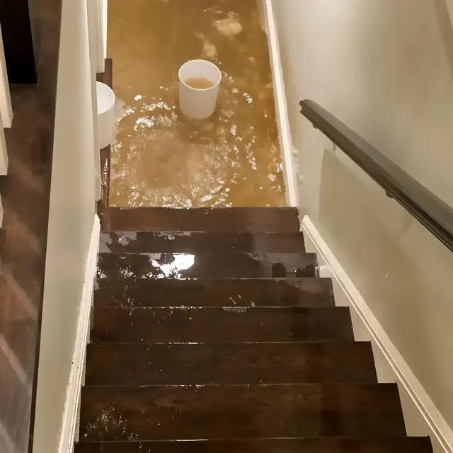 Storm water pooled at the bottom of a basement staircase after a cloudburst in Queens